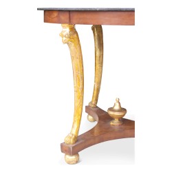 Empire \"Eagle s Head\" pedestal table in mahogany and gilded wood.